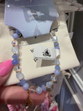 Beaded bracelet with a visible brand tag in the background