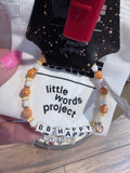 Bracelet with letter beads on a 'little words project. BB Happy