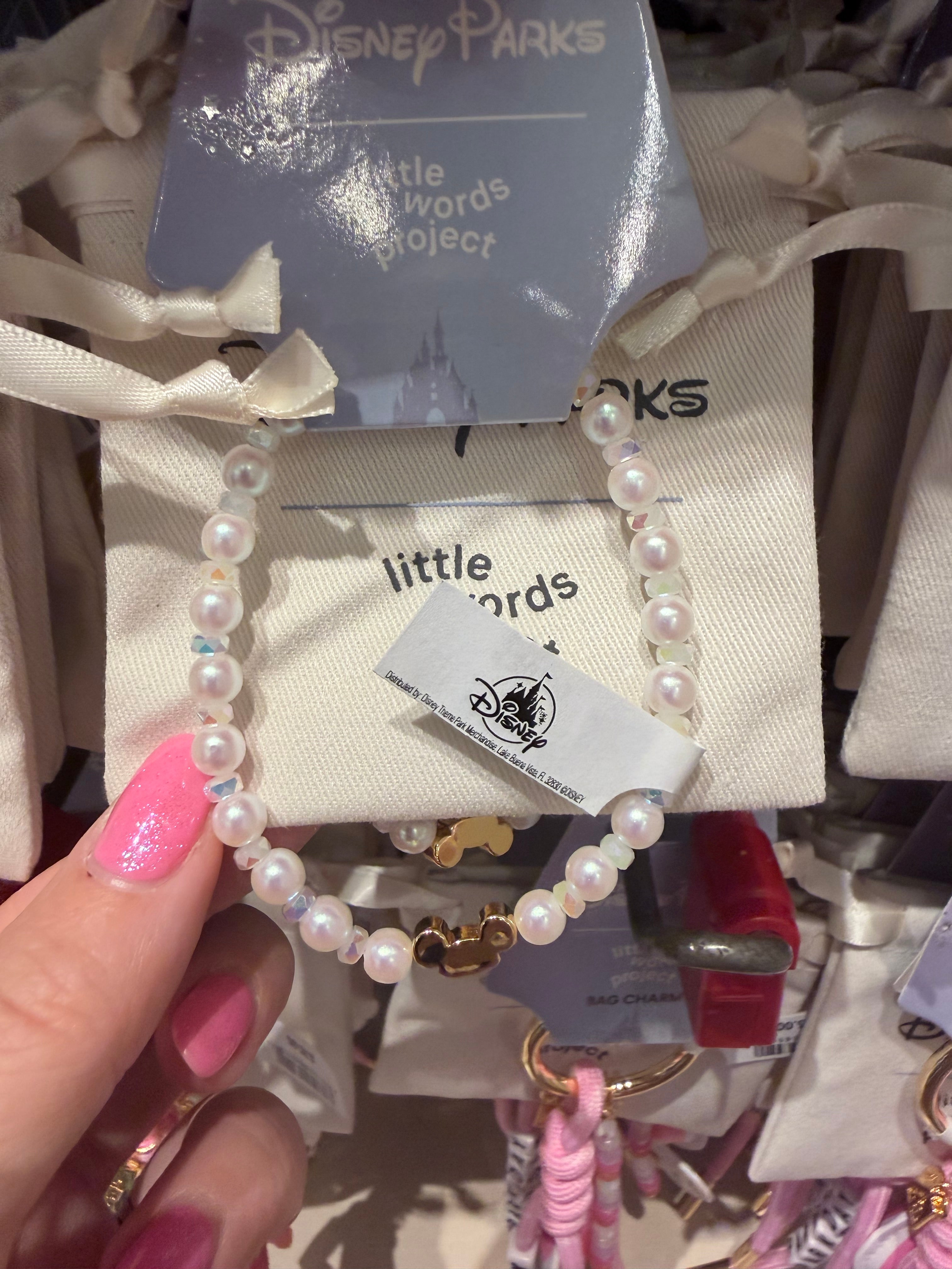 Pearl bracelet visible brand tag in the background