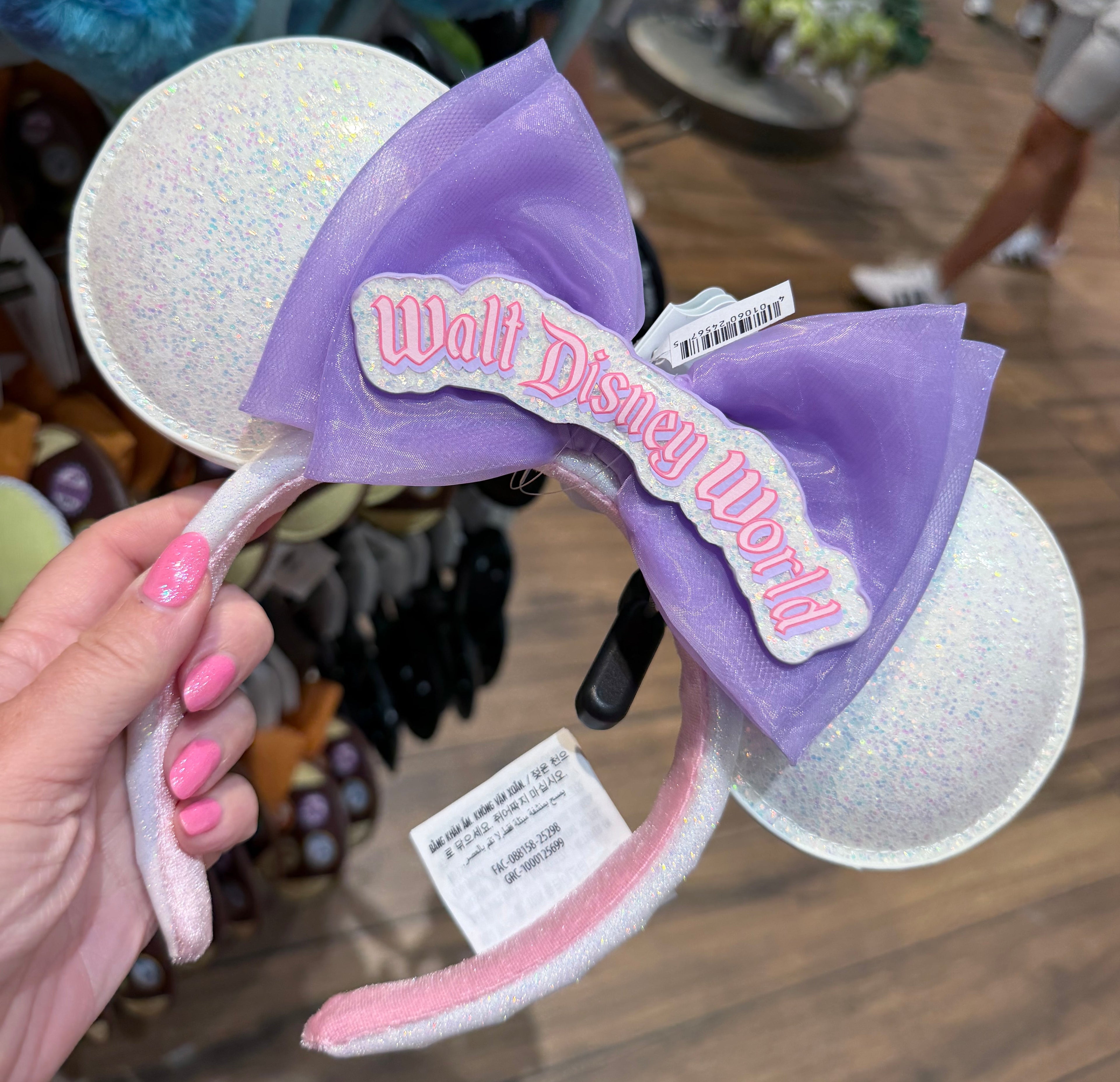 Mouse ears with a purple bow labeled 'Walt Disney World'