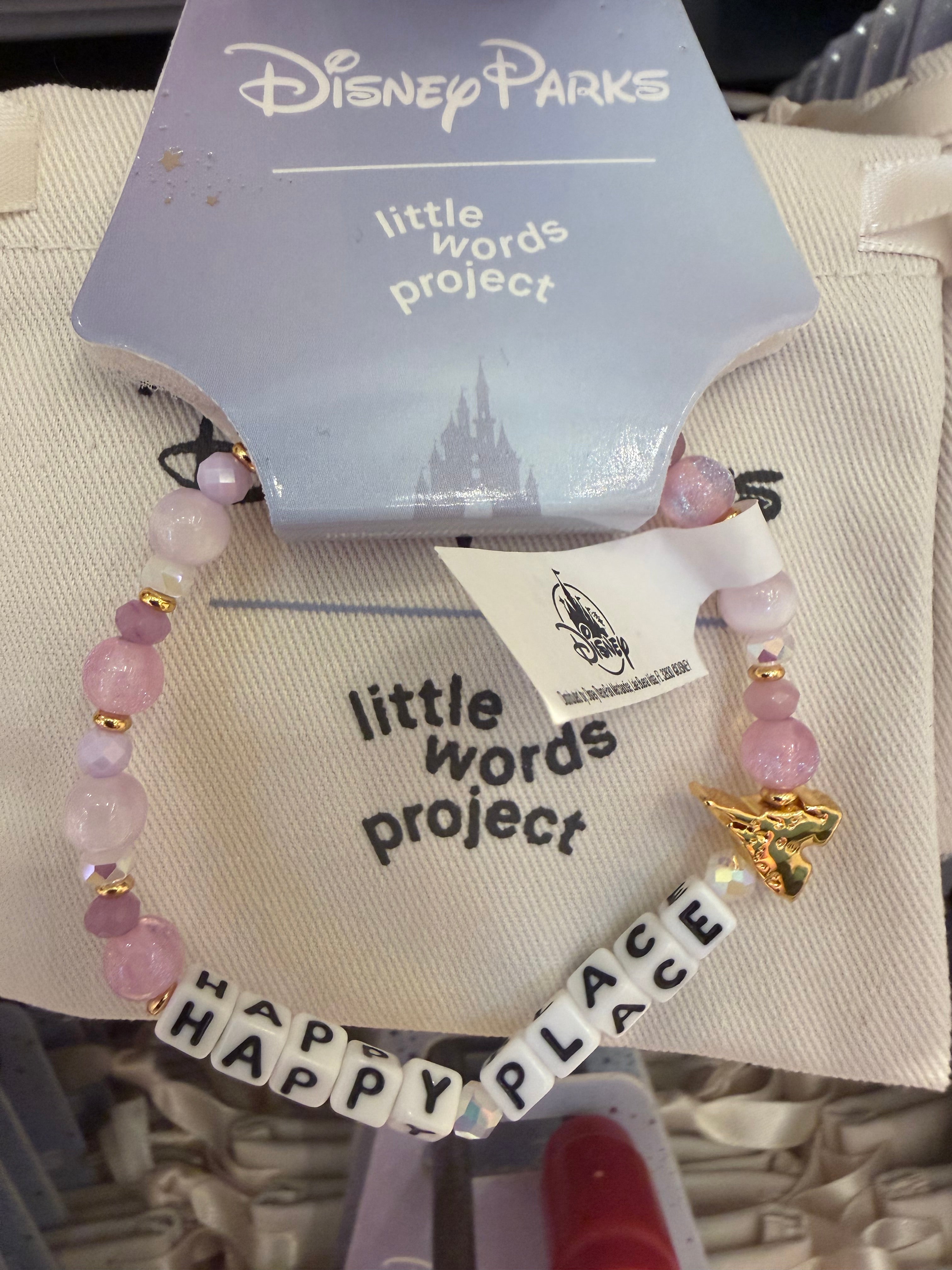 Bracelet with 'HAPPY PLACE' beads on a Disney Parks branded card
